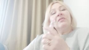 The thick smoke of my cigarette hides my face from you in a dense fog