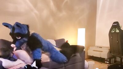 Two kinky guys in puppy costumes are having sex on the couch