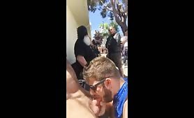 Horny stud eating a cock in public reunion