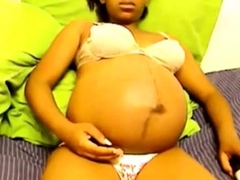 Heavily pregnant black cam chick