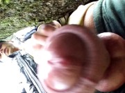 Close up cum behind tree in park and rubbing cum on camera lens with glans