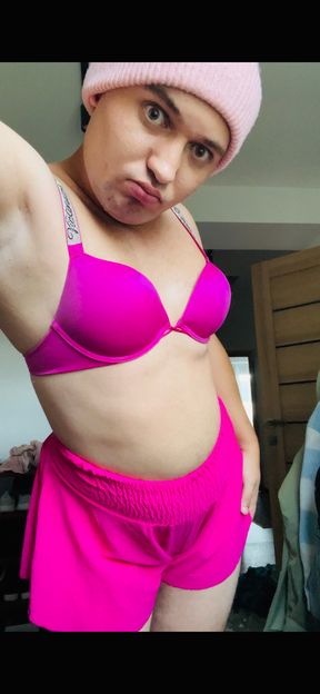 sissy in pink fucks her mouth with a dildo