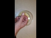 Piss and cum into a bowl. Using piss as lube.