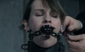 Brunette white girl clipped and pinned with paper clips and chained to the pole