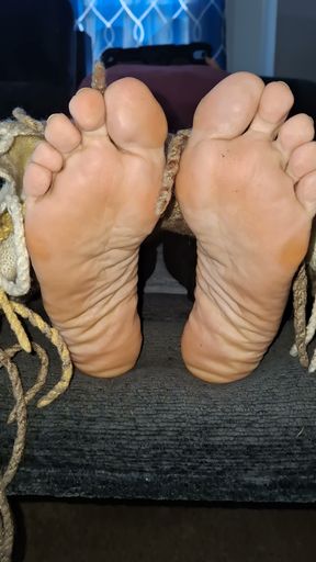 Removing the covers to reveal her cute, tired feet