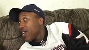 Big-titted black slut sucks gigantic black cock on the chesterfield