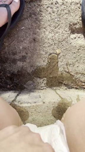 babe lifts up dress on steps to show her diaper while pissing and smoking