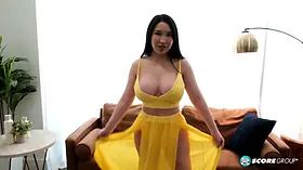 Suki Sin is built thick, with huge tits and a nice big ass. She toys her Asian pussy with a big dildo.