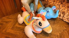 Nastya plays with an inflatable elephant and horse, sitting heavily on them, stepping on them, trampling them, jumping on them, and they are very heavy under Nastya's weight.