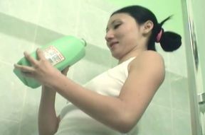Korean average girl in the bathroom pouring milk and soda on herself