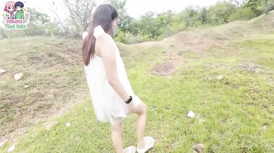 A Thai girl stops by the forest beside the walking path before playing with her pussy.