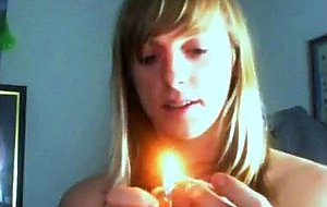 Blondie jerks off and eats her own cum from a glass sheet