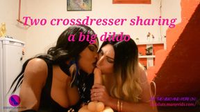 Two crossdresser sharing a big dildo