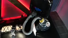 The slave's master takes control in a scene of dominance and submission.