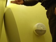 Pissing in a yellow public toilet