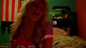 Sassy and skanky blondie on webcam masturbating on her bed