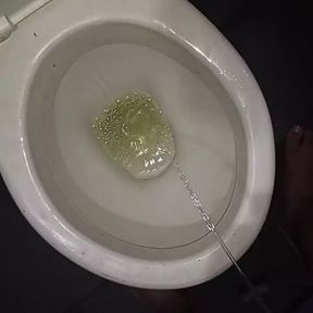 Peeing in the toilet with catheter in penis