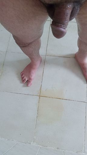 I pee on the bathroom floor, then sat on my pee and began masturbating