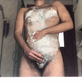 Hairy man massaging himself with foam while masturbating