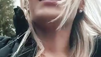German blonde with big, firm tits is masturbating in her car, in the middle of the day