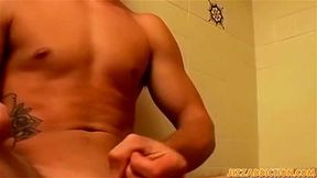 Tattooed jocks shower masturbation jizzing in condom