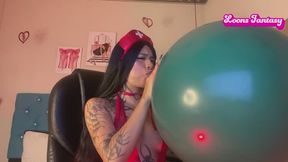 Dani blows up a huge balloon