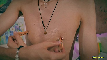 Playing with my nipples, oil and clamps.