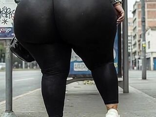 "Masked big beautiful woman Changes from Ebony Leggings to Small Strap at Public Bus Stop"