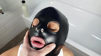 Pervert bitch sucks my cock in the bathtub and I fuck her face with leather slave mask