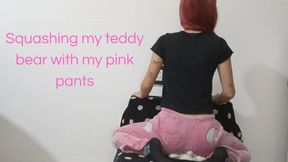 Squashing my teddy bear with my pink pants