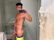 Quick hotel bathroom cumshot into sink in swim trunks while friend is gone
