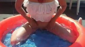 Slender white wife with saggy boobs is in the inflatable pool