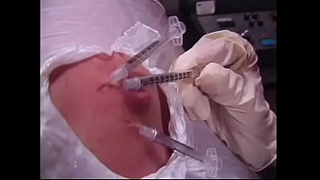 A naughty brunette and a busty redhead bitches wrapped a guy&#039_s body with a film and injected him with syringes