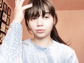 Brunette with natural big lips with natural color lipgloss smokin' a cigarette blowing smoke in your face