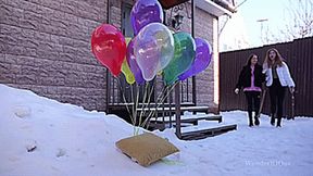 Winter popping helium balloons