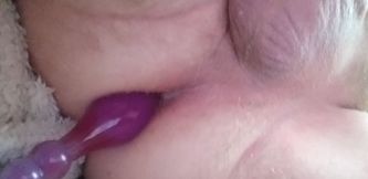 lying in bed and playing with a dildo in my ass and playing with my cock