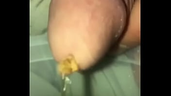 Close up piss in a cup