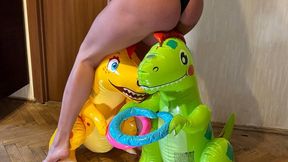 Nastya steps barefoot on the inflatable dinosaurs, steps very hard, tramples them, sits on them with all her weight, it’s very difficult for them to hold Nastya on themselves, but she doesn’t spare them