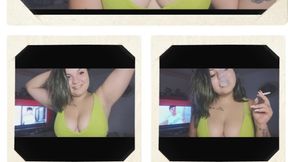 the girl smoking in her green bra