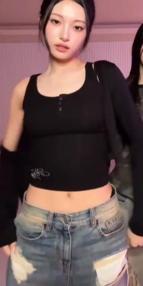 Slim k-pop fan poses with bellybutton and cute