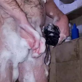 Ginger cub taking a shower