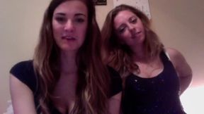Two Beautiful Girls Talking and Typing