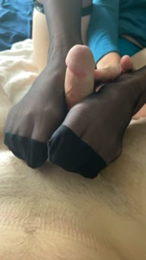 Elegant black stocking footjob